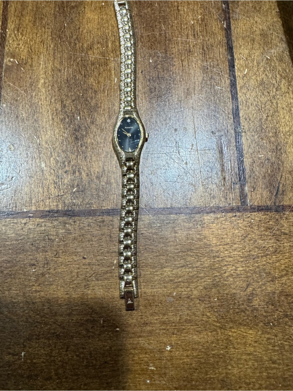 Elegant Gold-Tone Women's Bracelet Watch with Black Dial